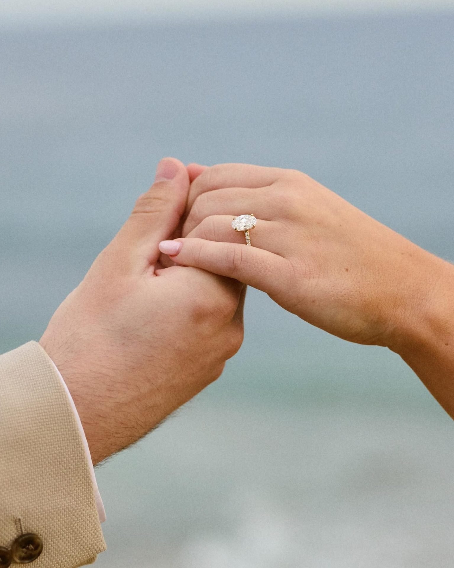 A couple and their lab-grown diamond engagement ring
